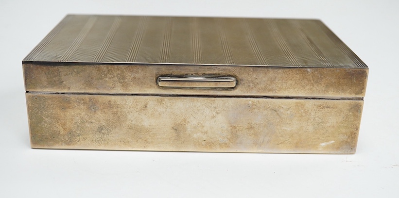 An Elizabeth II part engine turned rectangular silver cigarette box, by Padgett & Braham, Ltd, London 1960, 14cm. Condition - fair to good